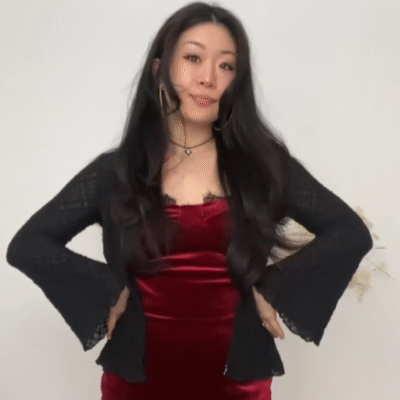 Our collaborator Anna in a red dress and black cardigan